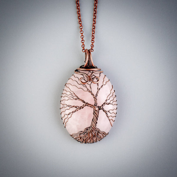 Handmade copper tree of life pendant with natural rose quartz crystal