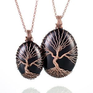 Matching black onyx tree of life necklaces for couples